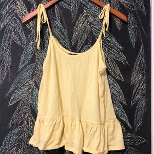 Yellow trefoil camisole with tie straps.